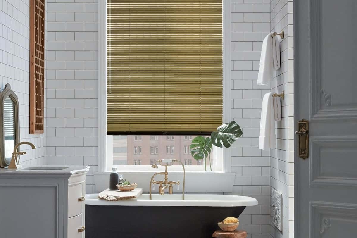 A bathroom window with Hunter Douglas Modern Precious Metals® Mini Blinds near Cape Coral, Florida (FL)