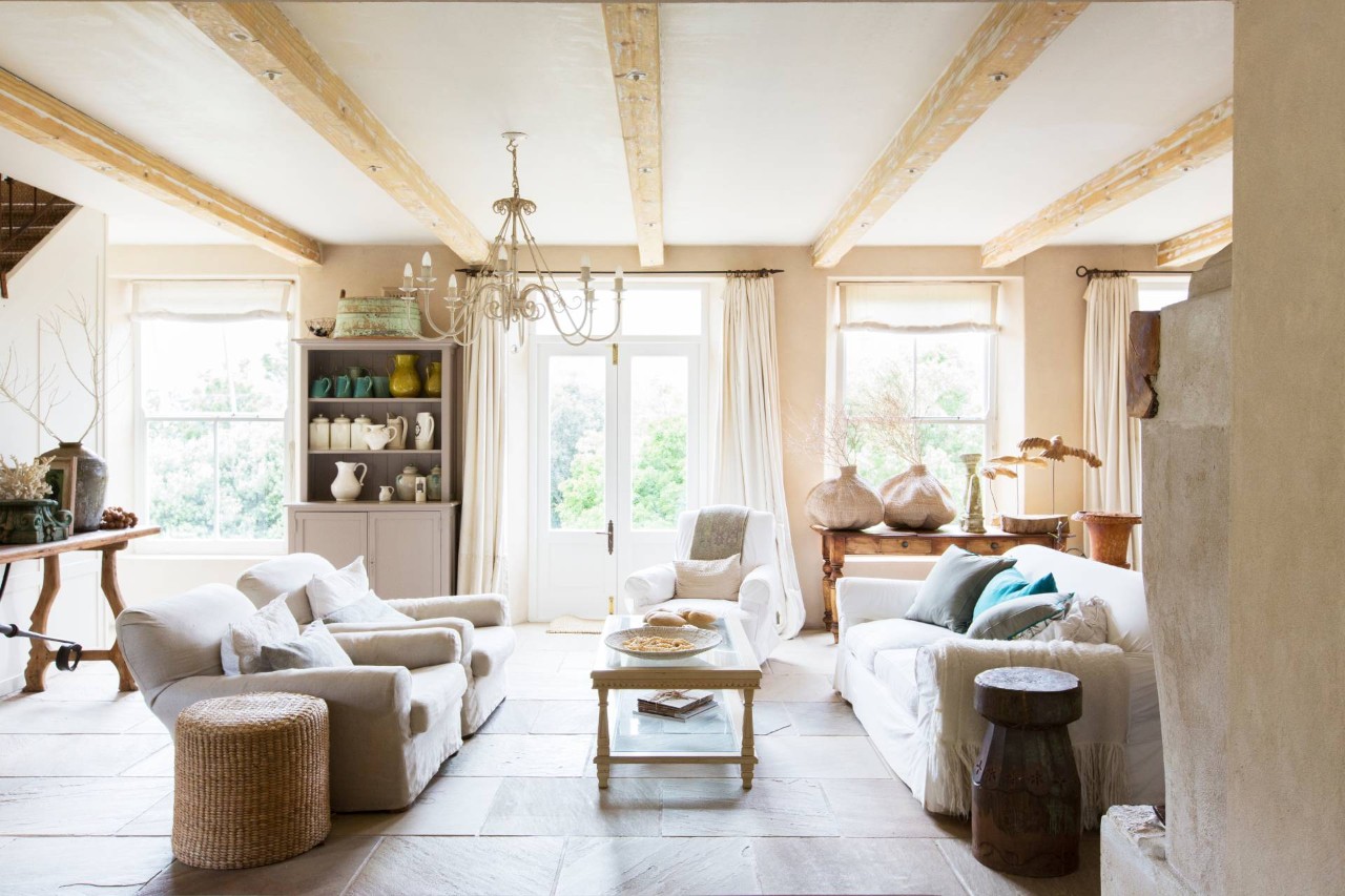 A farmhouse living room with wood accents and furniture at Blind & Shutter Gallery near Cape Coral, FL
